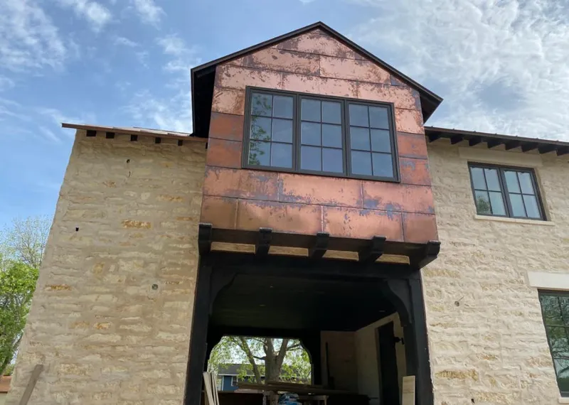 Copper metal panel facade on a stone building for Roof Repair in American Canyon